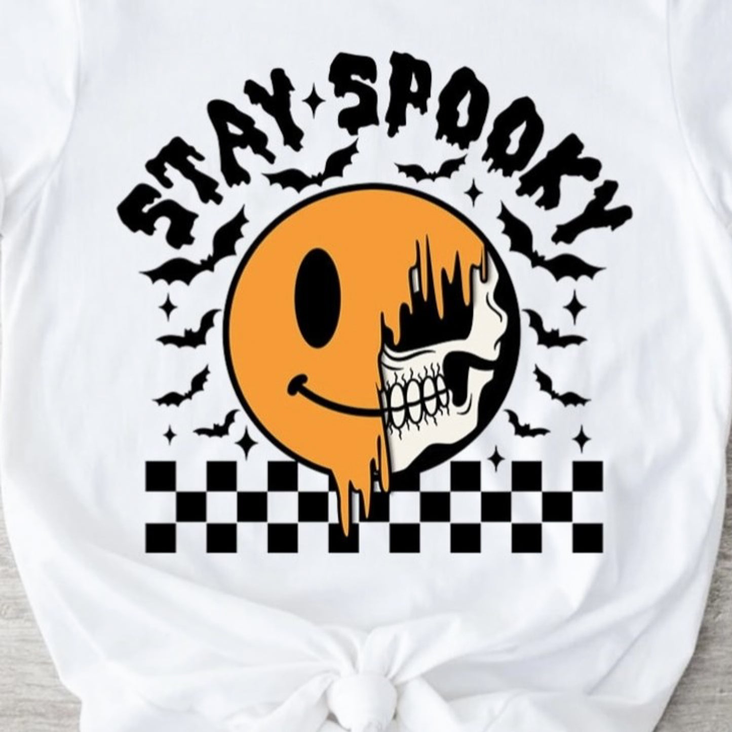 Stay Spooky Smiley Skeleton With Checkered Background Tee