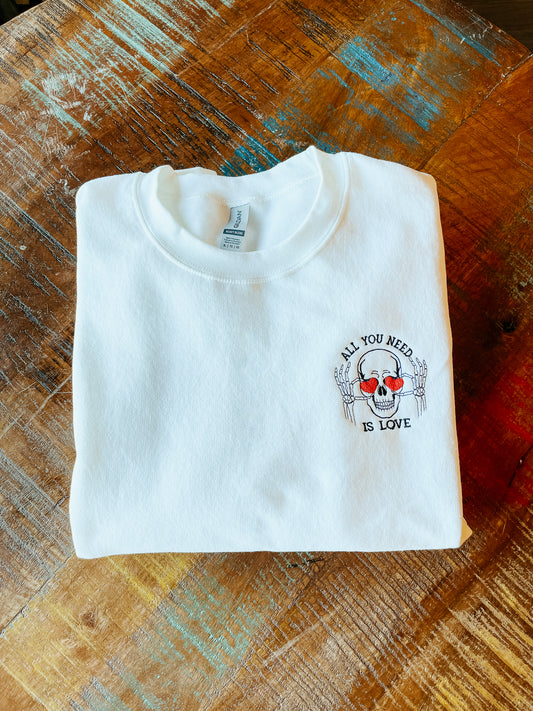 All You Need Is Love Skeleton Embroidered Pocket Logo Crew Sweatshirt
