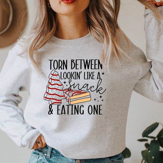 Torn Between Lookin' Like A Snack & Eating One Christmas Tree Cake Crew Sweatshirt