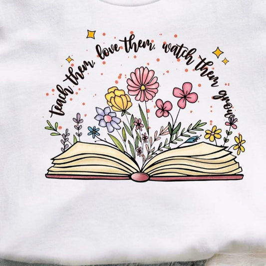 Teach Them Love Them Watch Them Grow Book With Flowers Tee