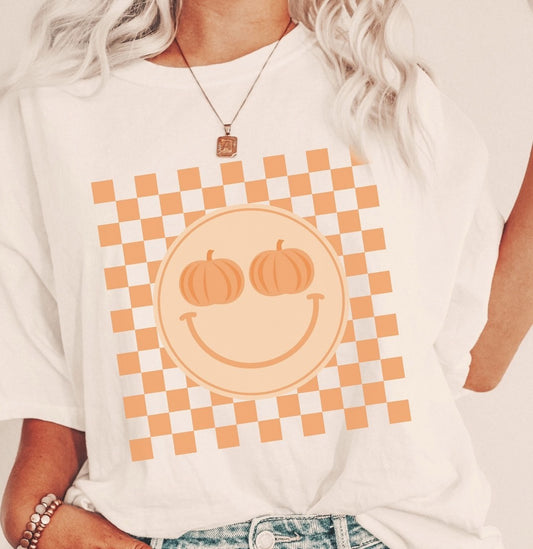 *Smiley Face With Pumpkin Eyes & Checkered Background T-Shirt or Crew Sweatshirt