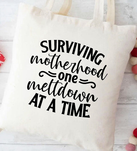 Surviving Motherhood One Meltdown At A Time Canvas Tote Bag